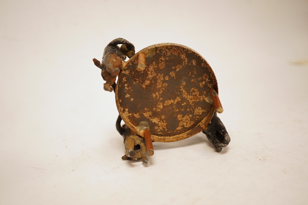 A cold painted spelter miniature ‘dog’ group, 6.5cm